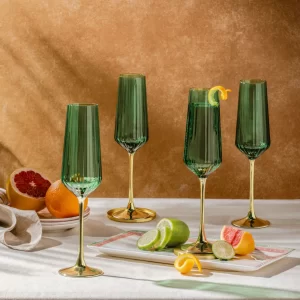 Set of emerald champagne flutes styled for dining