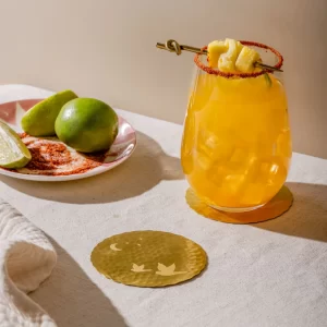 Masion Lustré Dove coasters styled with glasses