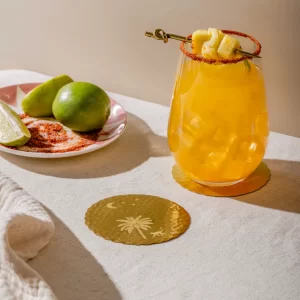 Masion Lustré Leaf Monkey coasters styled with glasses