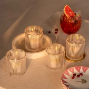 Sunset tea light holder styled with glasses and plates